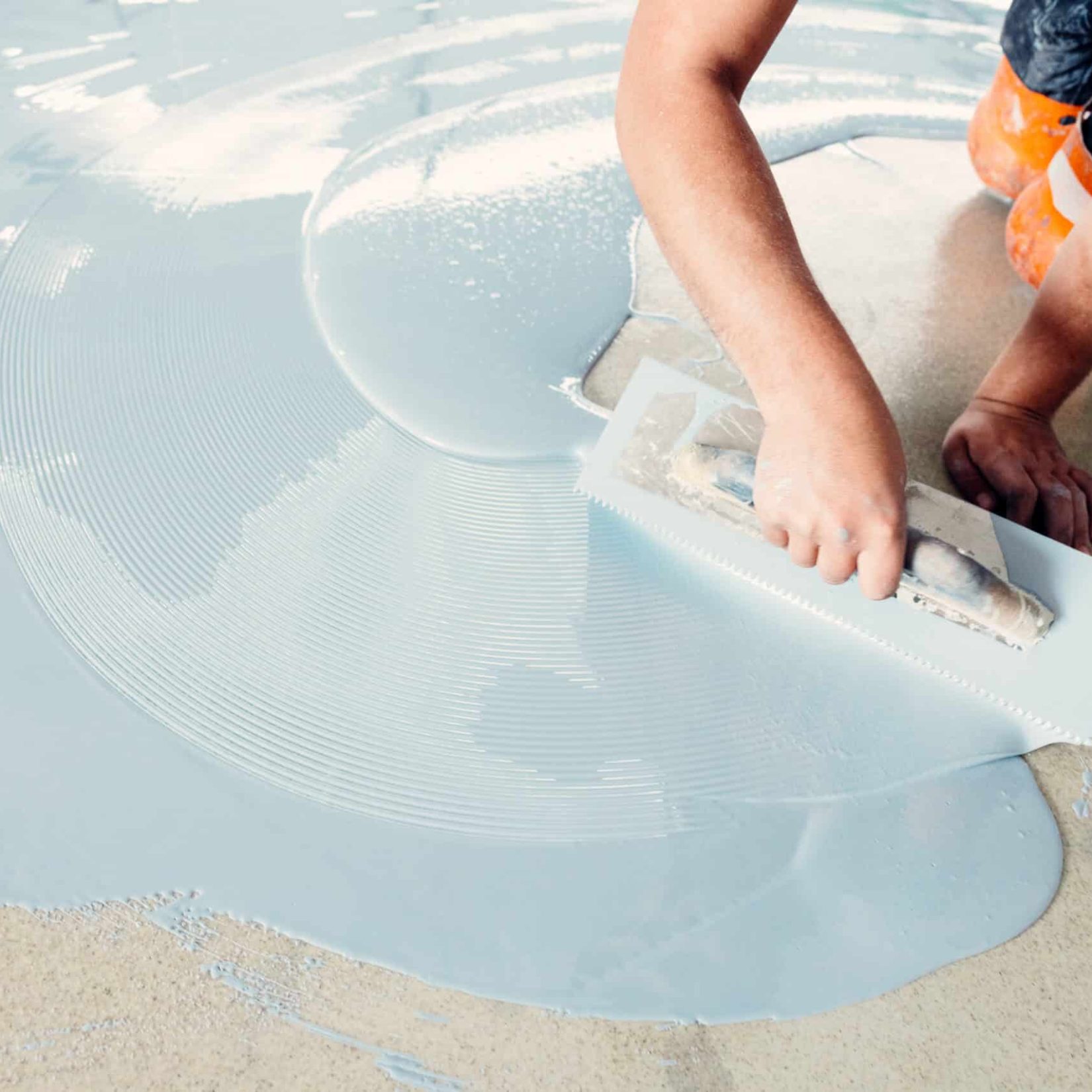 Applying pool plaster with a trowel for a smooth finish at Jms Pool Plastering.